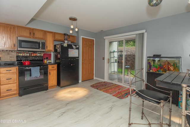 kitchen with black appliances, dark countertops, brown cabinetry, tasteful backsplash, and baseboards