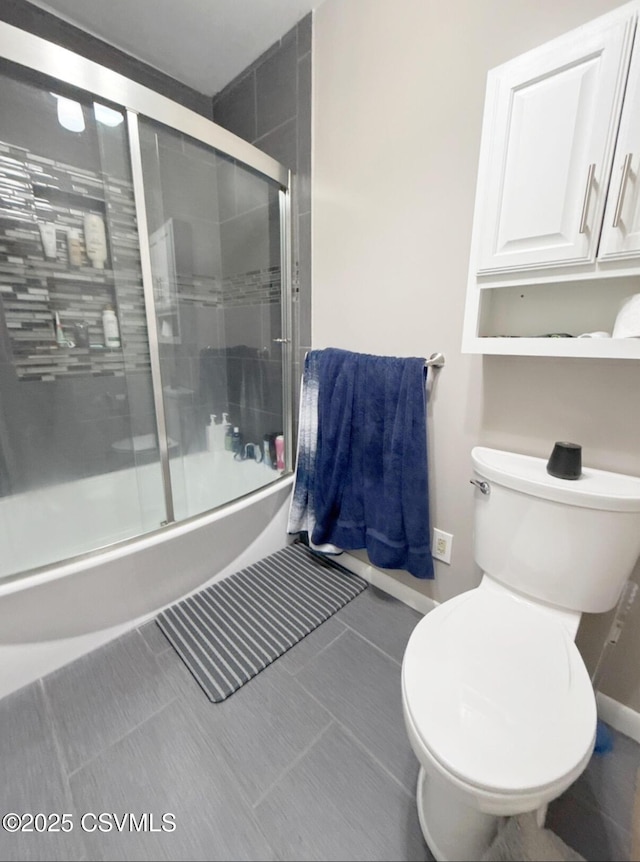 172 Ivy Ln, Danville, PA 17821 - bathroom featuring enclosed tub / shower combo, toilet, and baseboards