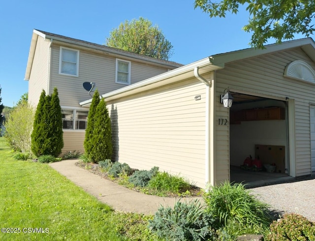 172 Ivy Ln, Danville, PA 17821 - view of side of property featuring an attached garage and a yard