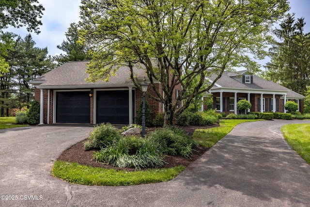 304 Hardscrabble Ln, Lewisburg, PA 17837 - view of front of property with asphalt driveway, brick siding, and an attached garage