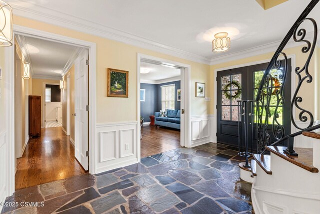 304 Hardscrabble Ln, Lewisburg, PA 17837 - entryway with a wainscoted wall, crown molding, a decorative wall, dark stone finish flooring, and french doors
