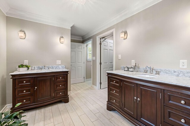 304 Hardscrabble Ln, Lewisburg, PA 17837 - bathroom with two vanities, crown molding, wood finished floors, and baseboards