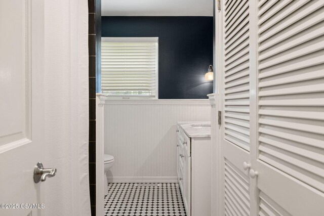 304 Hardscrabble Ln, Lewisburg, PA 17837 - full bathroom with a wainscoted wall, toilet, vanity, and baseboards