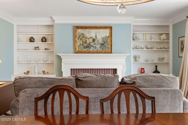 304 Hardscrabble Ln, Lewisburg, PA 17837 - living area with built in features, crown molding, and a fireplace