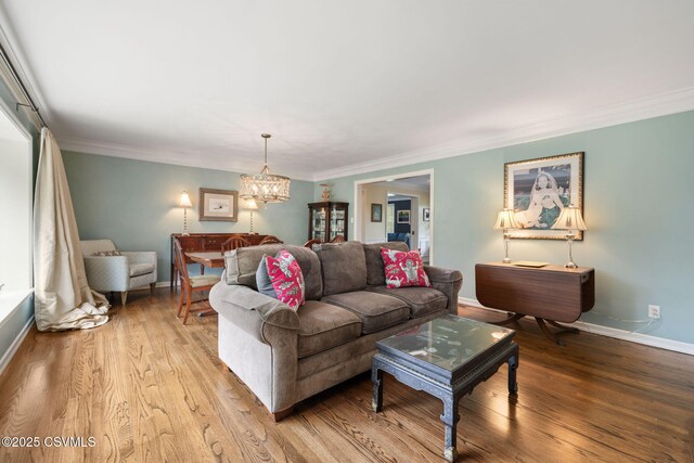 304 Hardscrabble Ln, Lewisburg, PA 17837 - living area featuring a chandelier, wood finished floors, crown molding, and baseboards