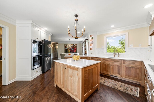 304 Hardscrabble Ln, Lewisburg, PA 17837 - kitchen with appliances with stainless steel finishes, a chandelier, ornamental molding, light countertops, and decorative backsplash