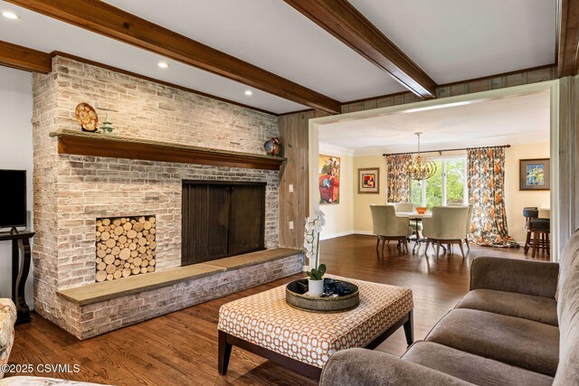 304 Hardscrabble Ln, Lewisburg, PA 17837 - living room featuring wood finished floors, a chandelier, beamed ceiling, baseboards, and a fireplace