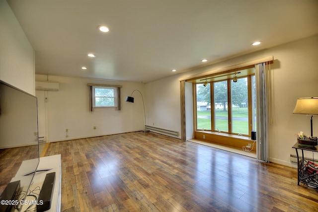 110 W 7 Th St, Mifflinville, PA 18631 - unfurnished living room with a baseboard heating unit, an AC wall unit, recessed lighting, hardwood / wood-style floors, and baseboards