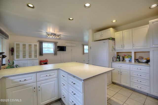 110 W 7 Th St, Mifflinville, PA 18631 - kitchen with freestanding refrigerator, light countertops, white cabinetry, light tile patterned floors, and recessed lighting