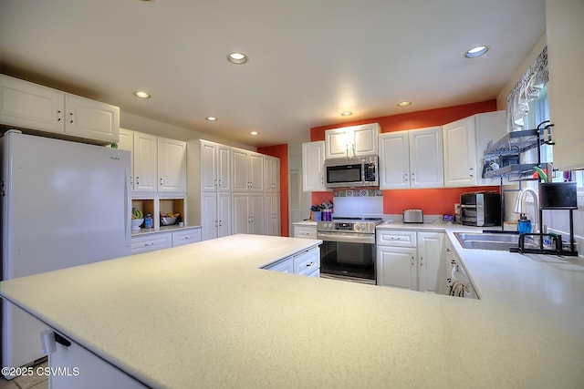 110 W 7 Th St, Mifflinville, PA 18631 - kitchen featuring appliances with stainless steel finishes, a sink, recessed lighting, white cabinetry, and light countertops