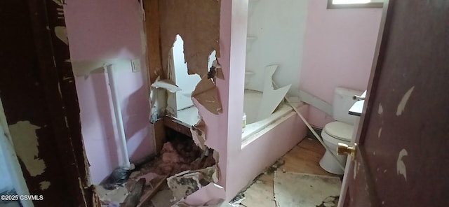 full bath with toilet, a bathtub, and a shower