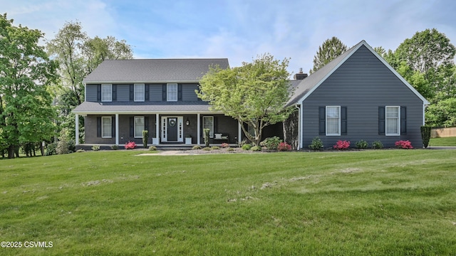 view of front facade featuring a front yard and covered porch