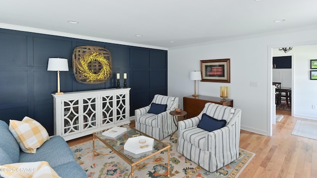living area with ornamental molding, wood finished floors, baseboards, and recessed lighting