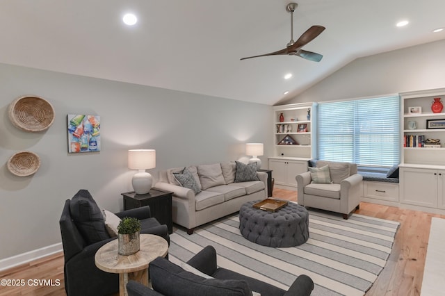 living area featuring light wood finished floors, ceiling fan, recessed lighting, and vaulted ceiling