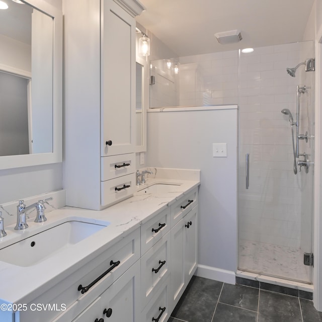 full bath featuring a stall shower, tile patterned flooring, and double vanity