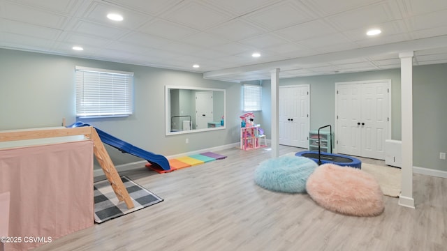 rec room with recessed lighting, wood finished floors, and baseboards