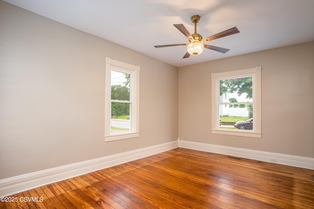 501 E 8th St, Berwick, PA 18603 - empty room featuring healthy amount of natural light, baseboards, hardwood / wood-style flooring, and ceiling fan