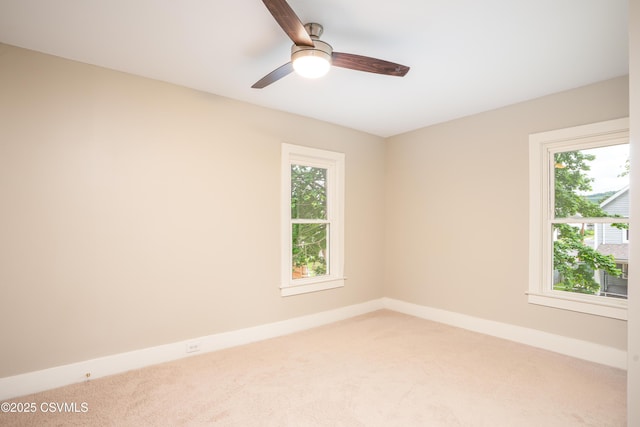 501 E 8th St, Berwick, PA 18603 - spare room featuring light colored carpet, a ceiling fan, and baseboards