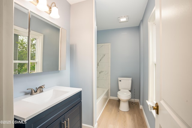 501 E 8th St, Berwick, PA 18603 - full bath featuring toilet, vanity, wood finished floors, and baseboards