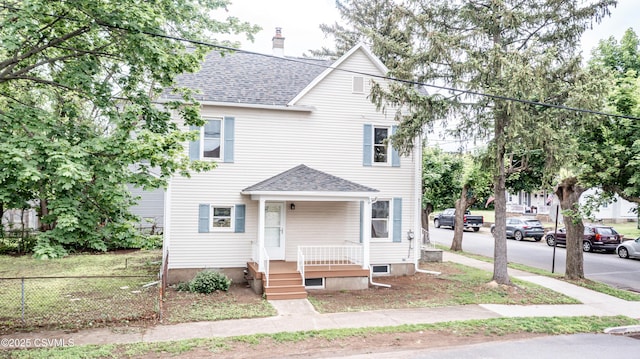 501 E 8th St, Berwick, PA 18603 - view of front of property featuring a shingled roof and a chimney