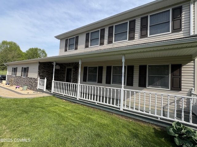 34 Fowlersville Rd, Bloomsburg, PA 17815 - view of front of property featuring covered porch, a front yard, and stone siding