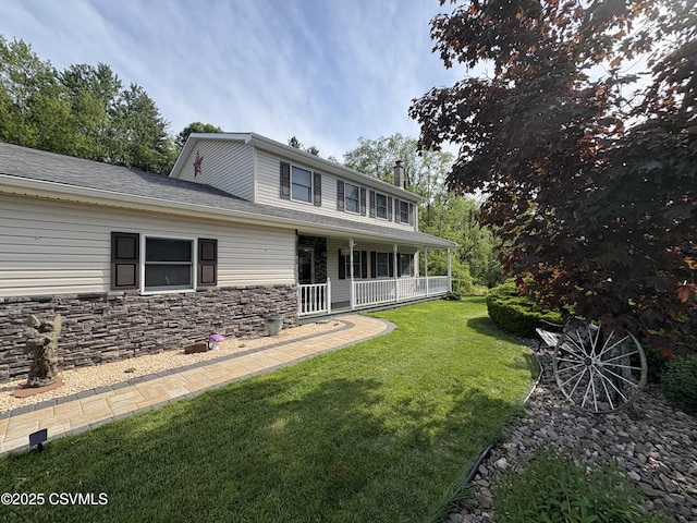 34 Fowlersville Rd, Bloomsburg, PA 17815 - view of front of house with a porch, a front yard, a chimney, roof with shingles, and stone siding