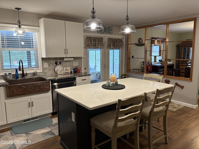 34 Fowlersville Rd, Bloomsburg, PA 17815 - kitchen with dishwasher, a sink, dark wood finished floors, and a center island