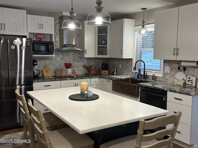 34 Fowlersville Rd, Bloomsburg, PA 17815 - kitchen featuring black appliances, wall chimney range hood, tasteful backsplash, a sink, and hanging light fixtures