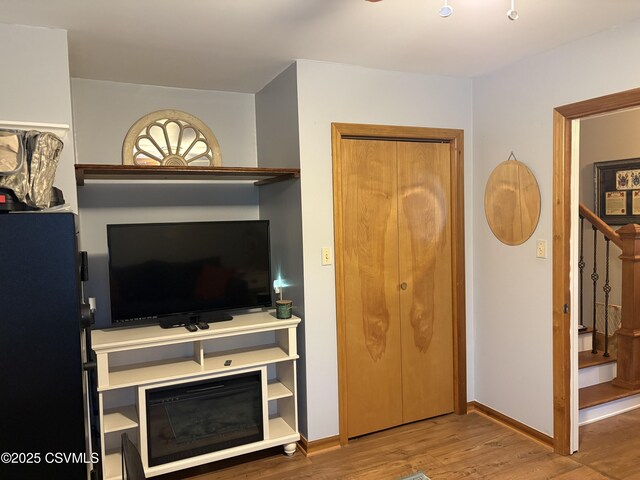 34 Fowlersville Rd, Bloomsburg, PA 17815 - living room featuring wood finished floors, stairs, and baseboards