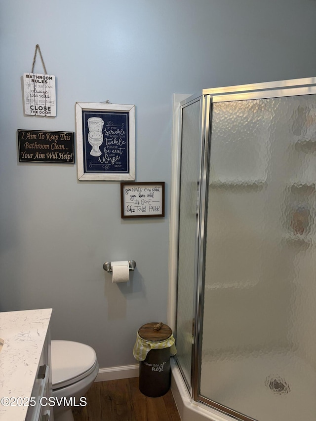 34 Fowlersville Rd, Bloomsburg, PA 17815 - full bath featuring baseboards, a stall shower, wood finished floors, vanity, and toilet