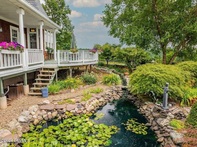 207 Klinger Hill Rd, Benton, PA 17814 - view of yard with a small pond, a deck, and stairs