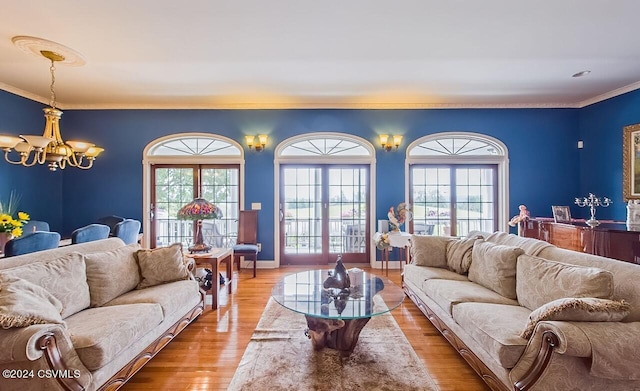 207 Klinger Hill Rd, Benton, PA 17814 - living room featuring a chandelier, light wood-type flooring, crown molding, and baseboards