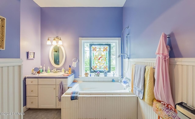 207 Klinger Hill Rd, Benton, PA 17814 - bathroom featuring a tub to relax in, vanity, and wainscoting