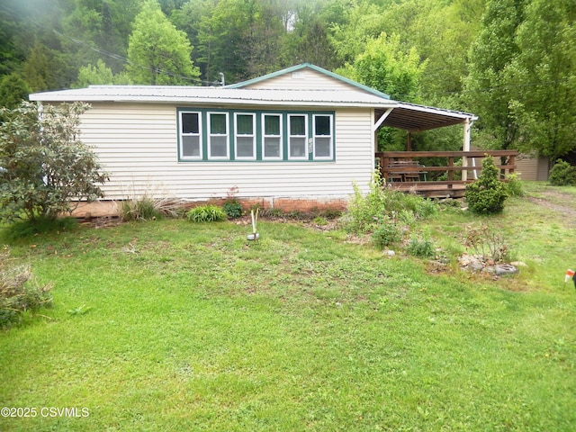 158 Apple Aly, Benton, PA 17814 - view of front of home featuring a front lawn, metal roof, and a wooded view