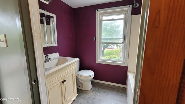 4523 State Route 61, Paxinos, PA 17860 - bathroom with toilet, vanity, plenty of natural light, and baseboards