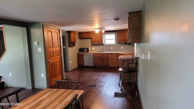 4523 State Route 61, Paxinos, PA 17860 - kitchen featuring dishwasher, light countertops, a sink, dark wood-type flooring, and black microwave