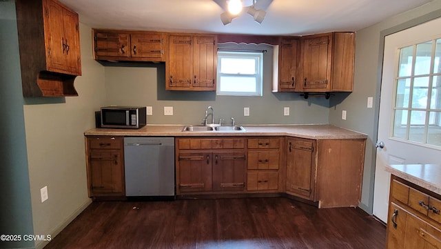 4523 State Route 61, Paxinos, PA 17860 - kitchen with appliances with stainless steel finishes, a sink, dark wood-type flooring, brown cabinets, and light countertops
