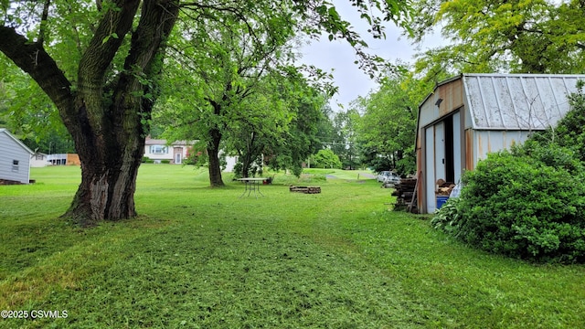 4523 State Route 61, Paxinos, PA 17860 - view of green lawn featuring an outbuilding and an outdoor fire pit