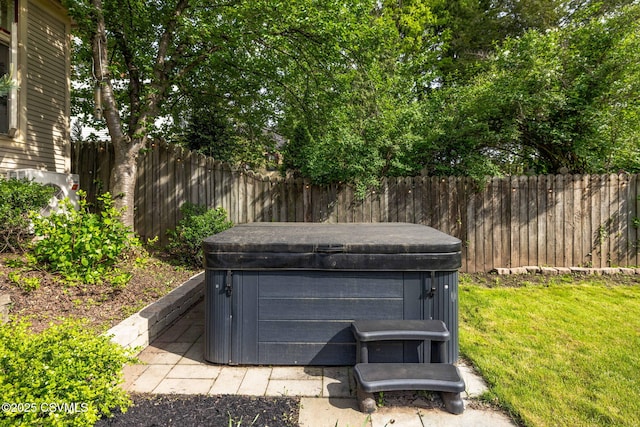 exterior view of a hot tub and fence