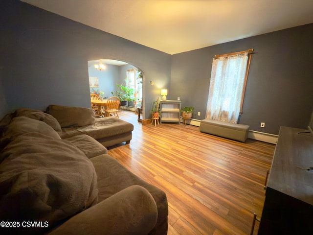 303 Melrose St, Marion Heights, PA 17832 - living room with arched walkways, wood finished floors, plenty of natural light, vaulted ceiling, and baseboards