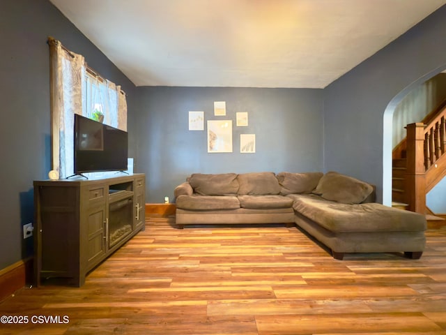 303 Melrose St, Marion Heights, PA 17832 - living area with light wood-type flooring, baseboards, and arched walkways