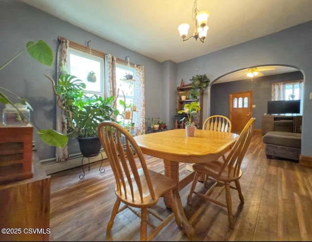 303 Melrose St, Marion Heights, PA 17832 - dining room with arched walkways, wood-type flooring, a chandelier, and healthy amount of natural light