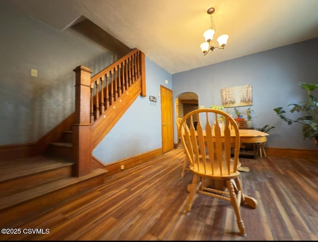 303 Melrose St, Marion Heights, PA 17832 - dining room with wood finished floors, stairs, a chandelier, arched walkways, and baseboards