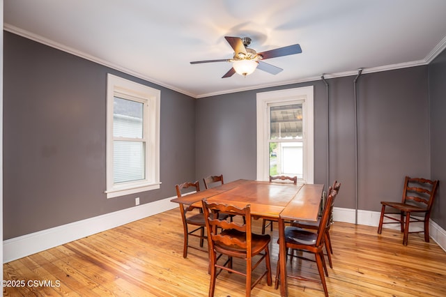 206 Orange St, Selinsgrove, PA 17870 - dining area featuring crown molding, light wood-type flooring, a ceiling fan, and baseboards