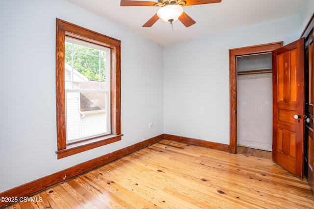 206 Orange St, Selinsgrove, PA 17870 - unfurnished bedroom featuring baseboards, a closet, light wood-style flooring, and a ceiling fan