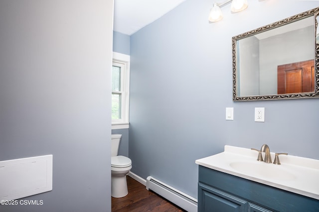 206 Orange St, Selinsgrove, PA 17870 - bathroom with baseboard heating, toilet, wood finished floors, vanity, and baseboards