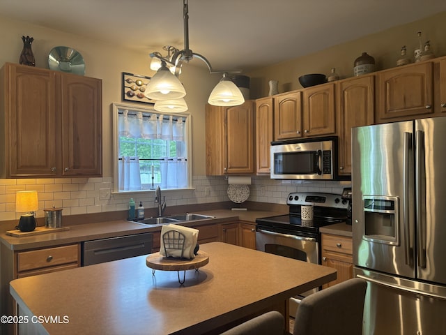 1874 Reading Tpke, Elysburg, PA 17824 - kitchen with stainless steel appliances, a sink, backsplash, pendant lighting, and dark countertops