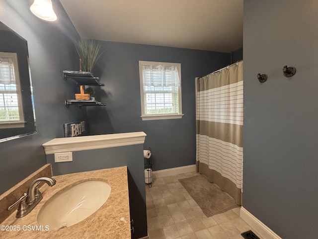 1874 Reading Tpke, Elysburg, PA 17824 - bathroom featuring baseboards, vanity, and a shower with shower curtain