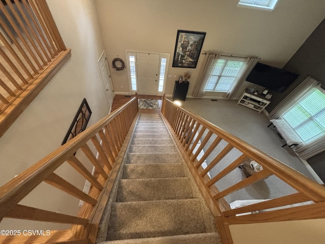1874 Reading Tpke, Elysburg, PA 17824 - stairs featuring a high ceiling, carpet flooring, and baseboards