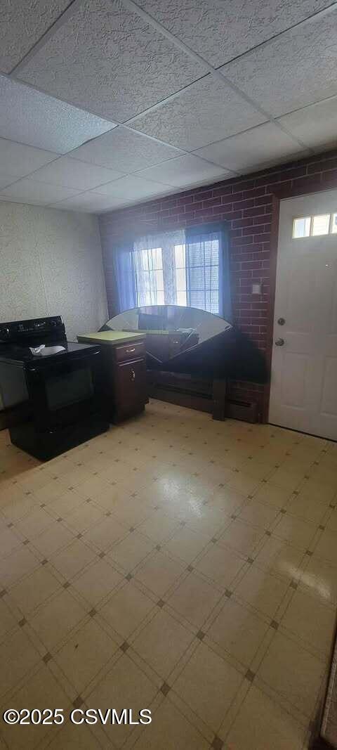 foyer featuring healthy amount of natural light and tile patterned floors
